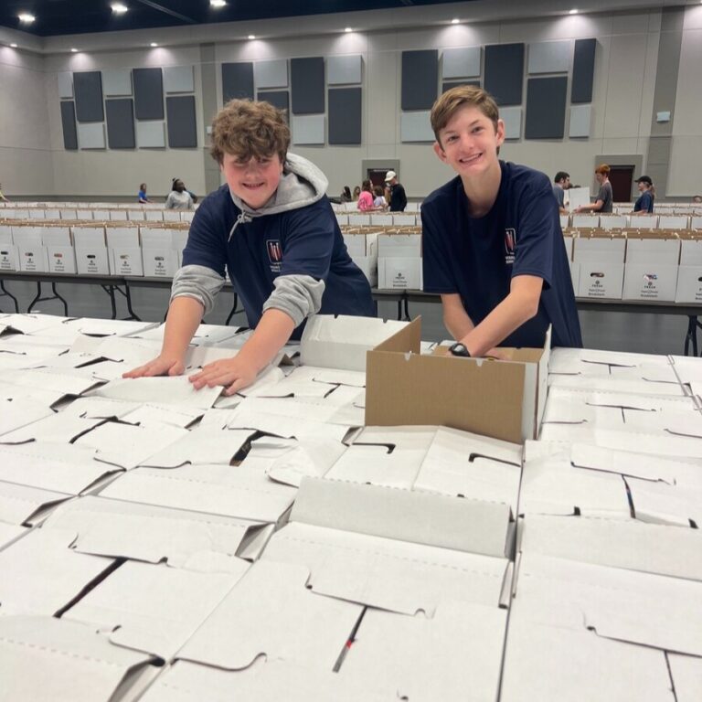 Kids packing meal boxes