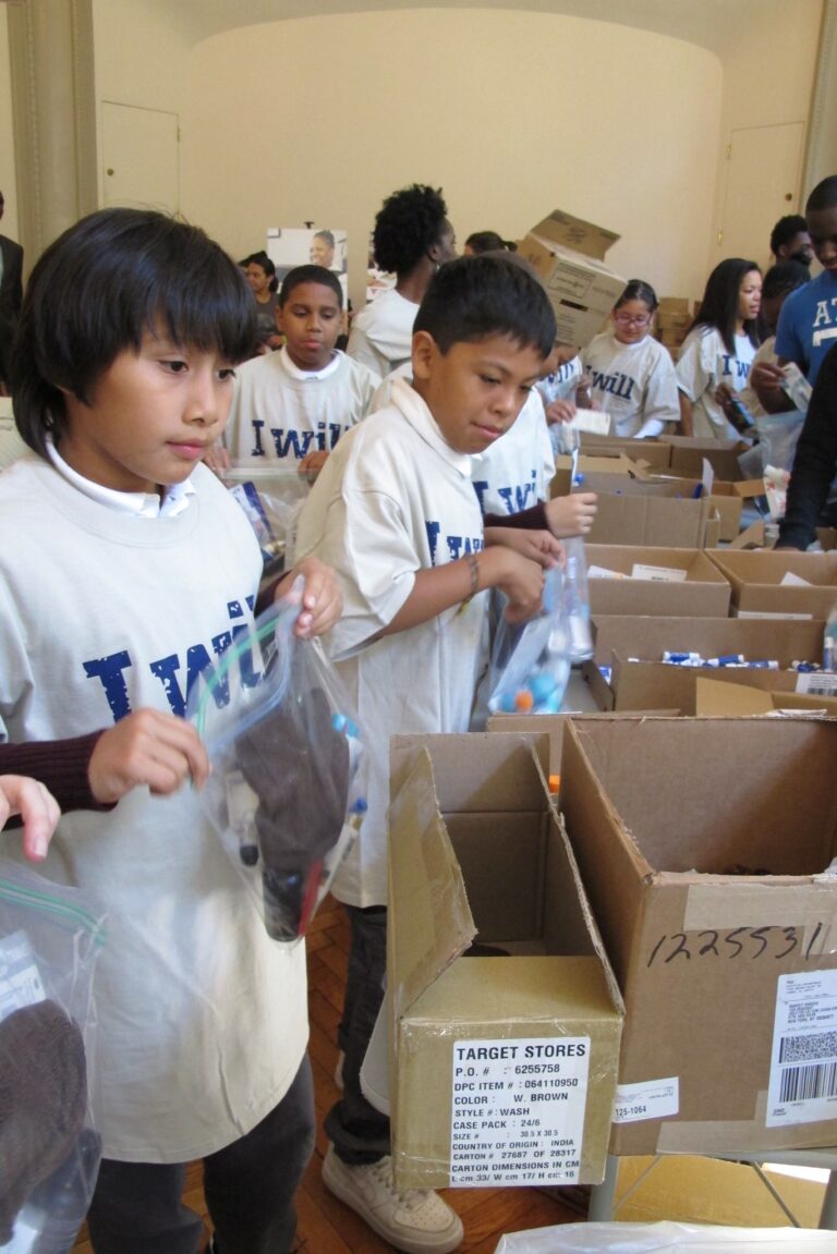 Kids packing meals at a hunger relief event in NYC
