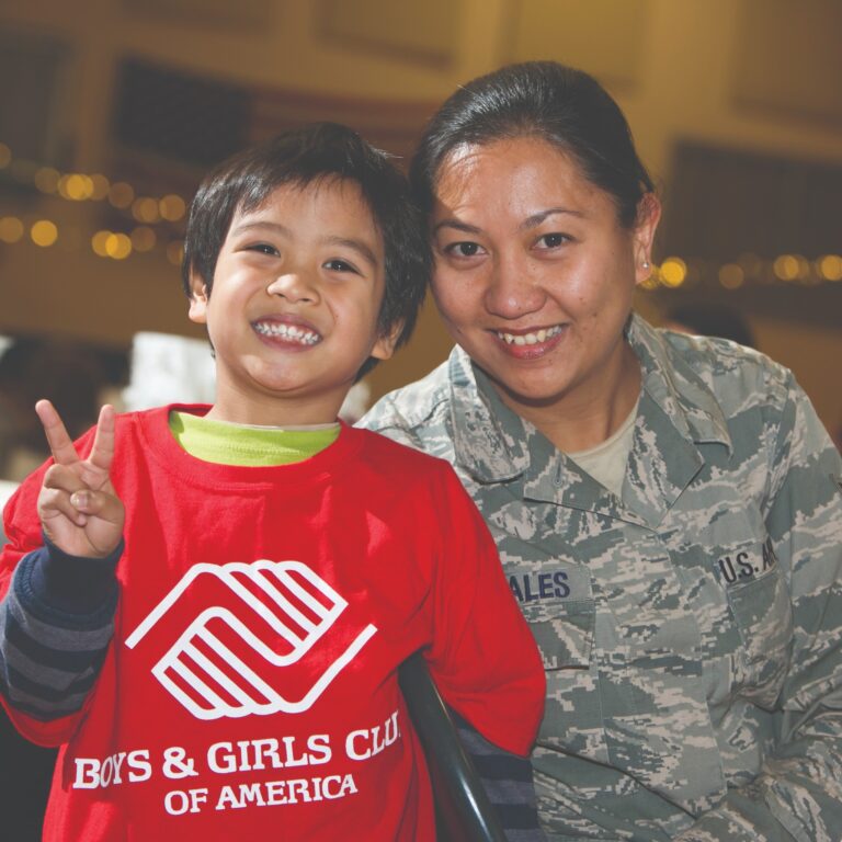 Posing at a 9:11 Day Boys and Girls Clubs of America volunteer event