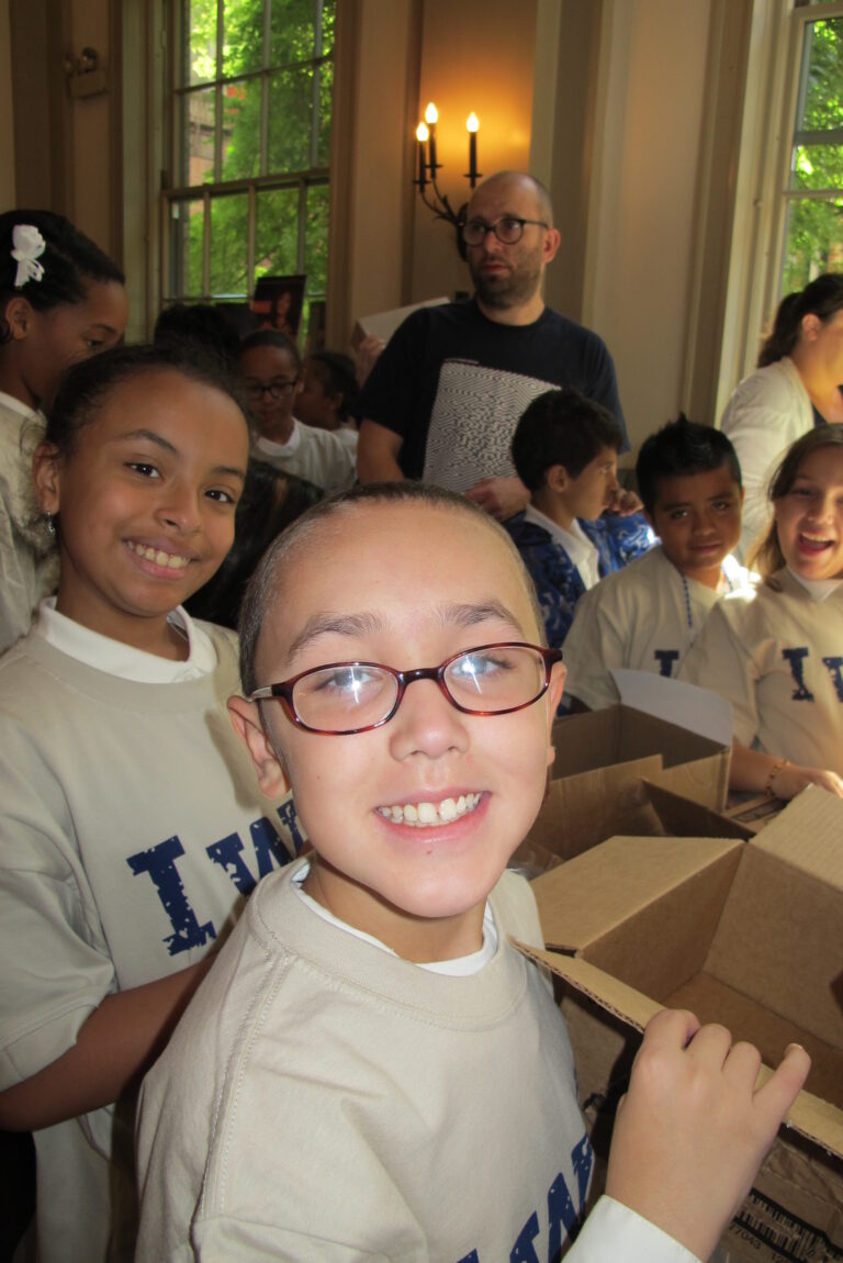 Kids packing meals a a hunger relief event in New York